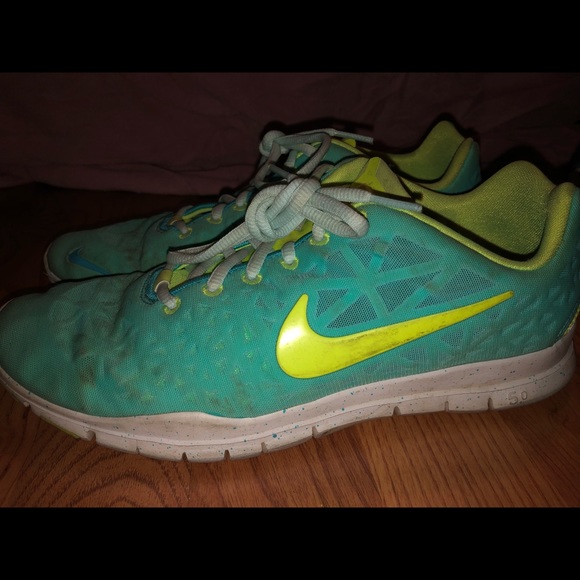 blue and neon green nike shoes